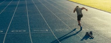 athlete,running,on,an,all weather,running,track,alone.,runner,sprinting