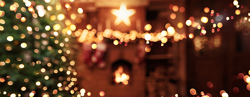 christmas,tree,with,illumination,near,the,fireplace.,home,decor